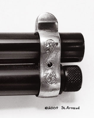 Decorative engraving on the front sight ring.